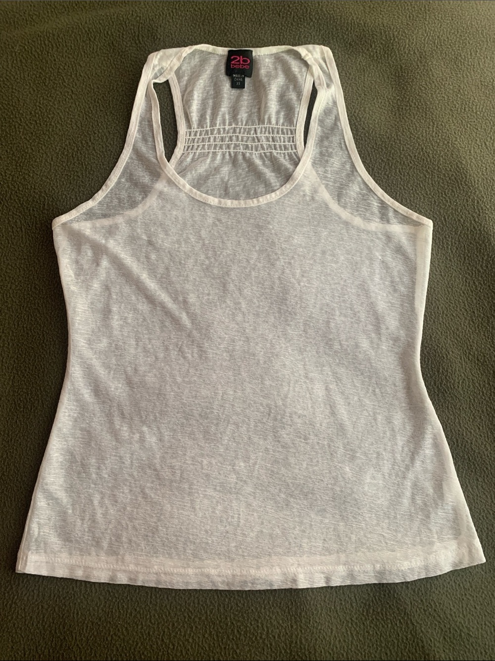 2b Bebe sheer white racer back shirt with gathers. Size XS.